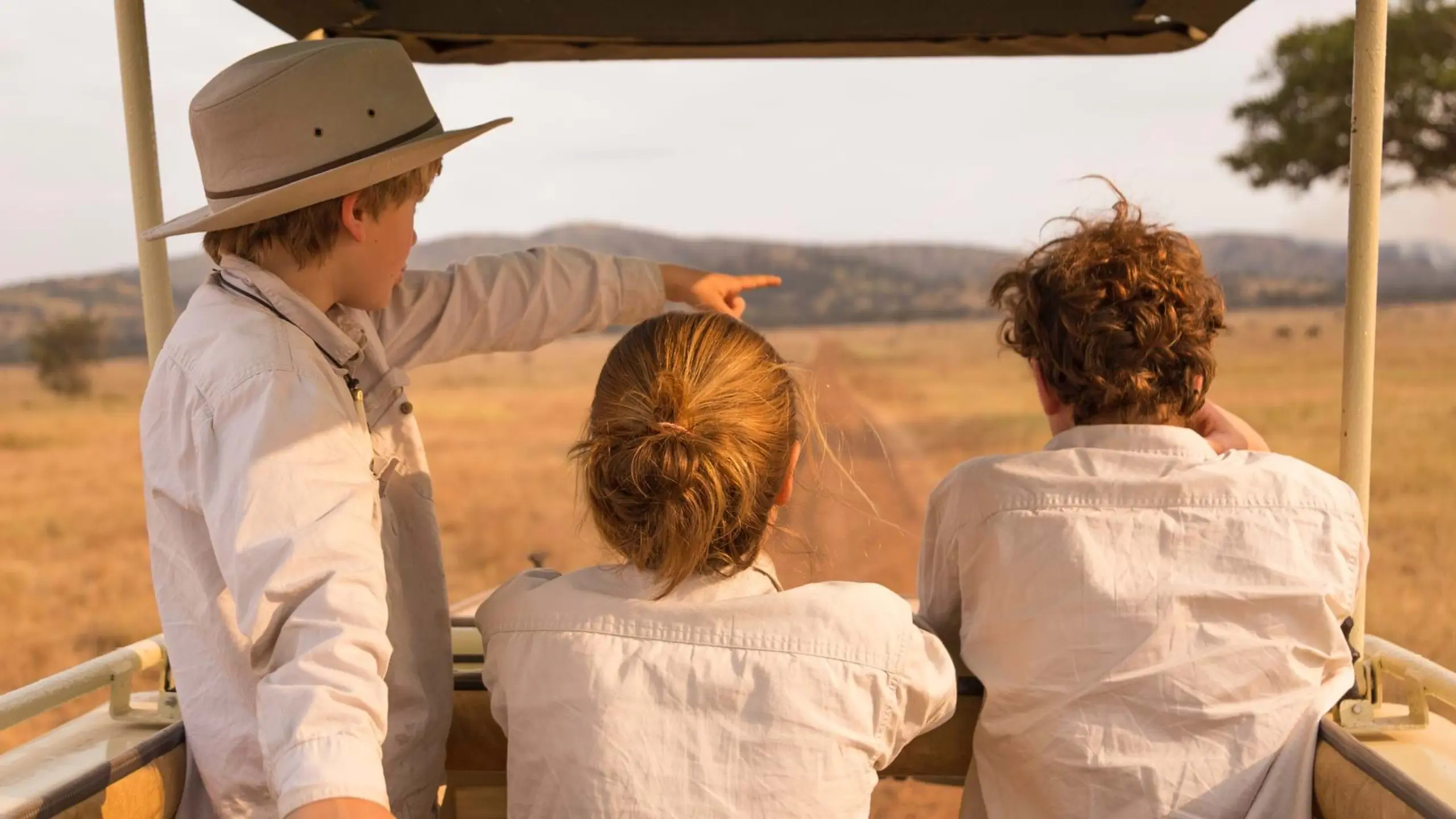 Kids spotting wildlife from the vehicle